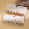 Twelve-piece geometric round twisted silver needle stud earrings fashionable commuter earrings