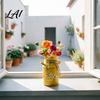 Decoração de casa – Flores e coroas artificiais