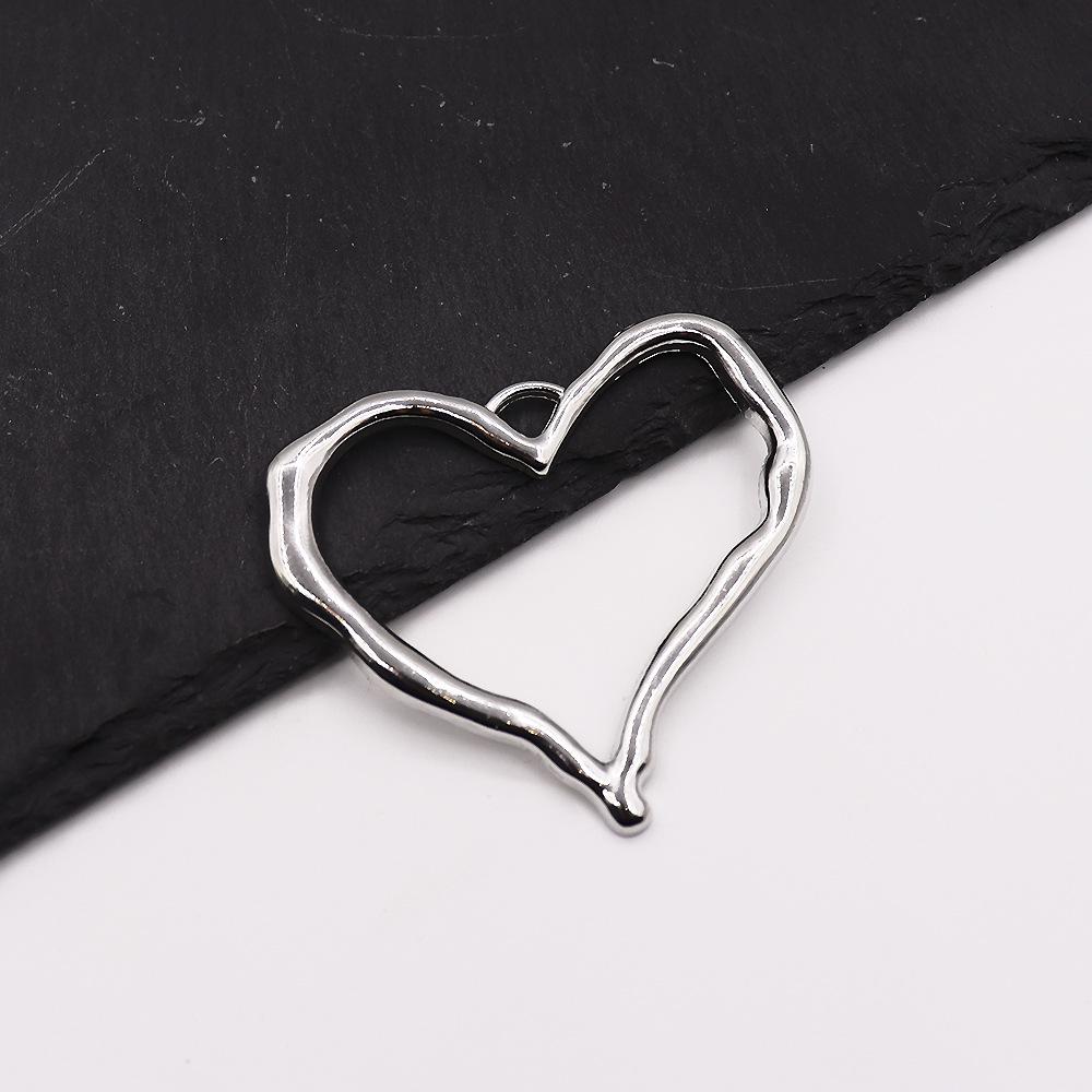 Cross-Border Love Pendant: Alloy Hollow Heart-Shaped DIY Jewelry and Earring Accessories