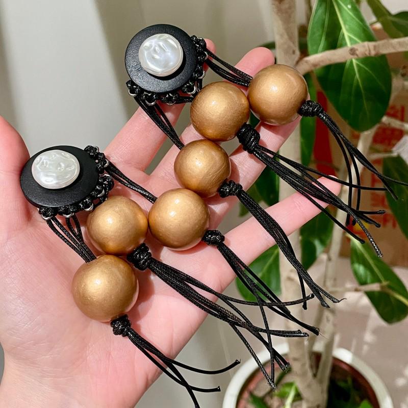 

Black Wood Tassel Earrings: Retro Ethnic Dangle with Beaded Design for Women