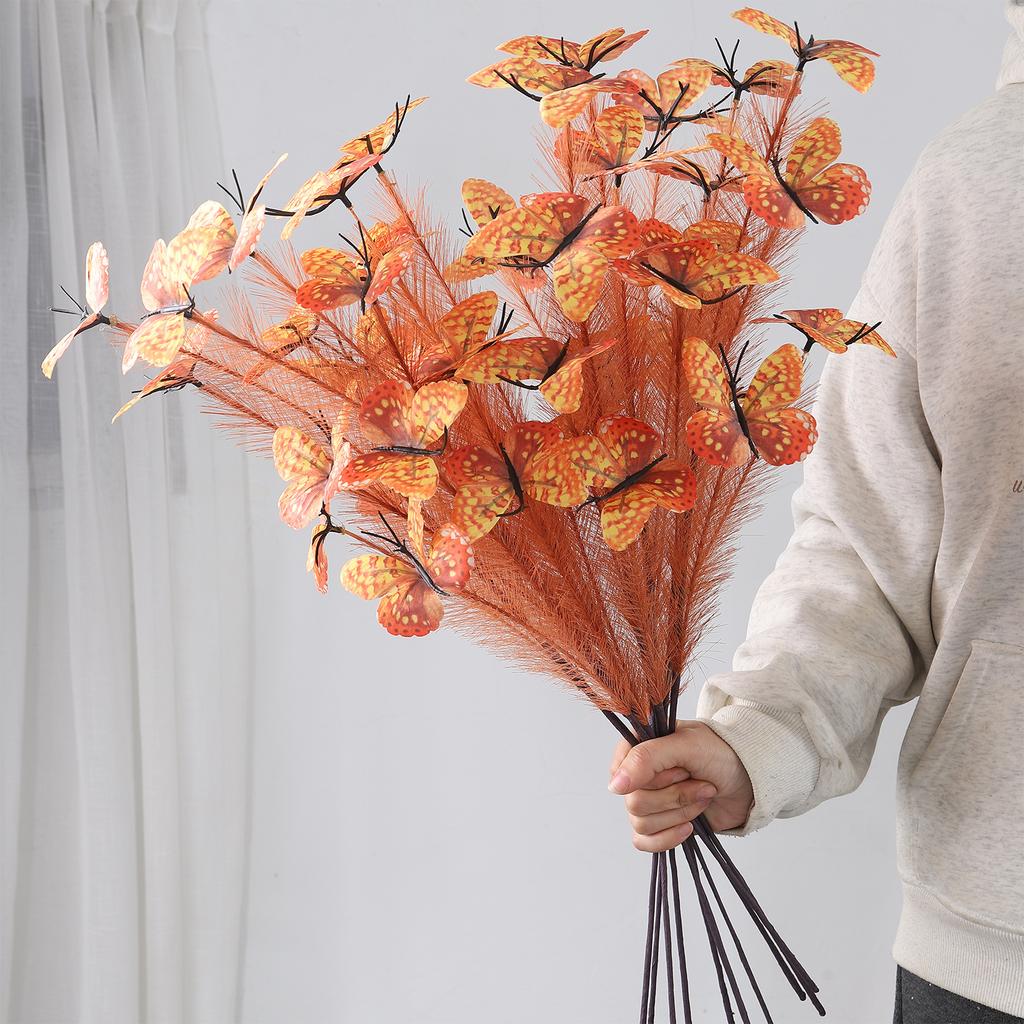 An artificial butterfly branch used for weddings, family offices, parties, decorating vases, and floral arrangements