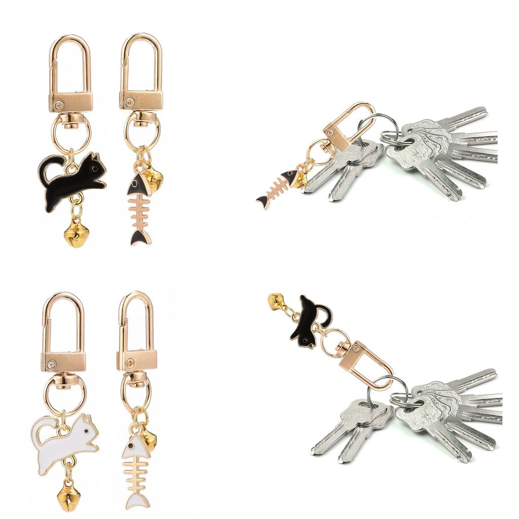 2 Stück Metall Schlüsselanhänger Set Modischer Paar Schlüsselanhänger Tropföl Schlüsselanhänger Praktisch und Unisex Katze und Fischgräte Schlüsselanhänger