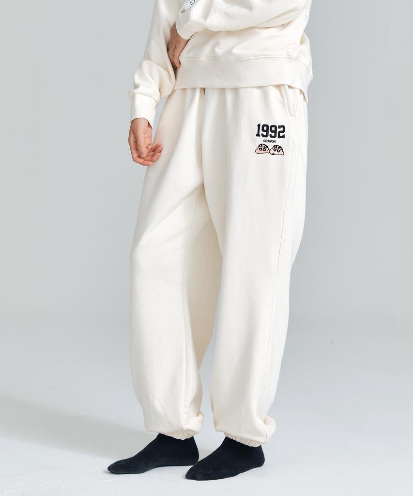 Daenkkomma Crayon Shin-Chan 1992 Face Embroidery Sweatpants (Black, Cream)
