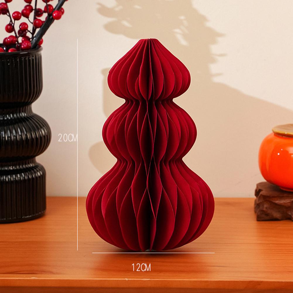 Lebhafte Faltbaumdekorationen in klassischer roter Farbe für Feiern