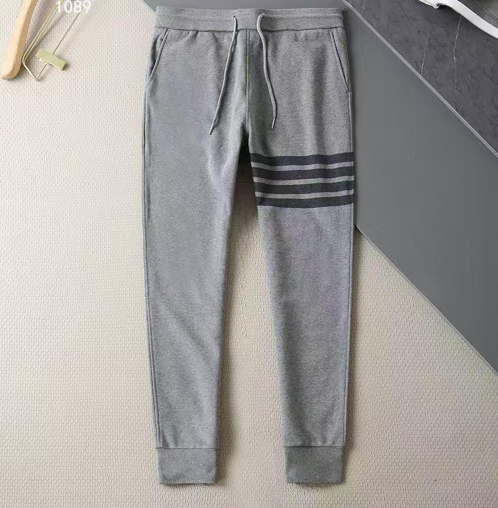 

Высококачественные хлопковые спортивные штаны с четырьмя полосками, окрашенные пряжей, унисекс, повседневная спортивная серия с длинными штанами на манжетах 3XL - Size 5