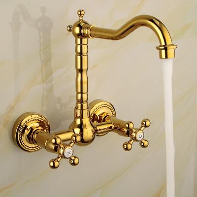 Grifo mezclador de lavabo de cocina de baño de latón dorado de lujo con caño giratorio y doble manija cruzada para montaje en pared.