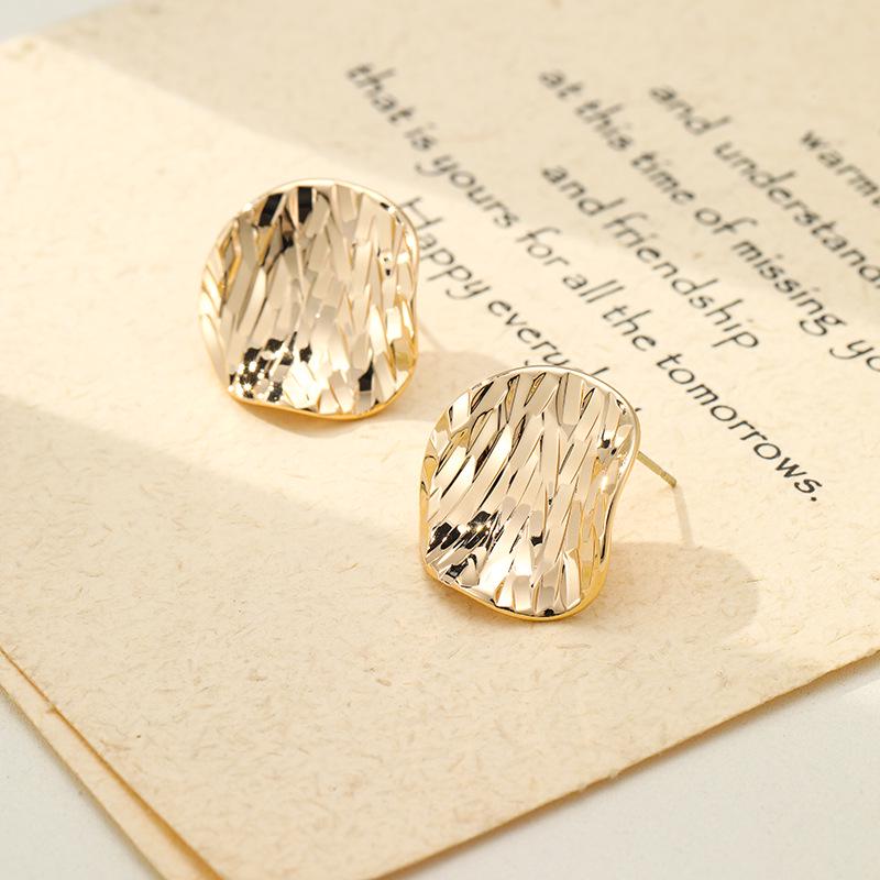 Irregular Crushed Ice Metal Stud Earrings: Luxurious French Design for Women.
