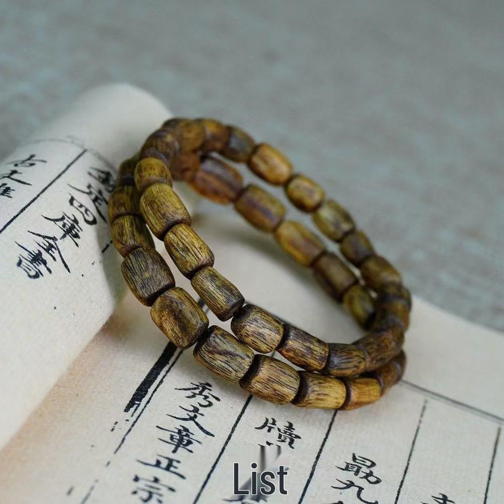 

Natural Green Qinan Agarwood Bracelet with Wormhole Resin
