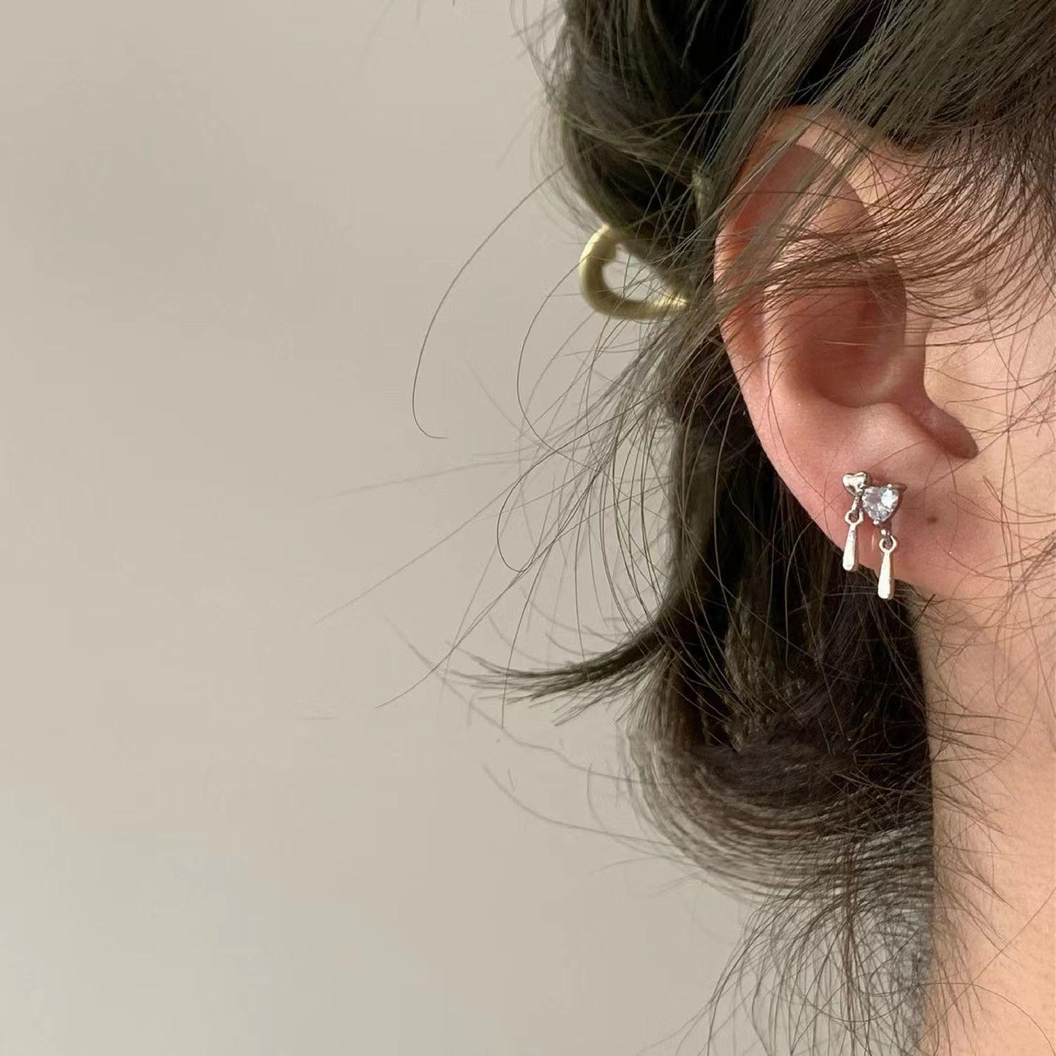 Heart-Stirring Double Heart Stud Earrings: Elegant, Versatile Design for Everyday Wear.
