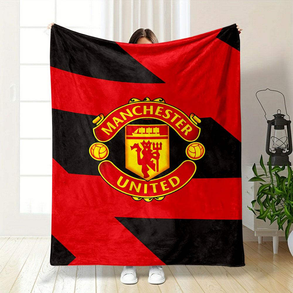 Diagonal red and black zigzag pattern with a central Manchester United logo. for all seasons blanket lunch break throw gift