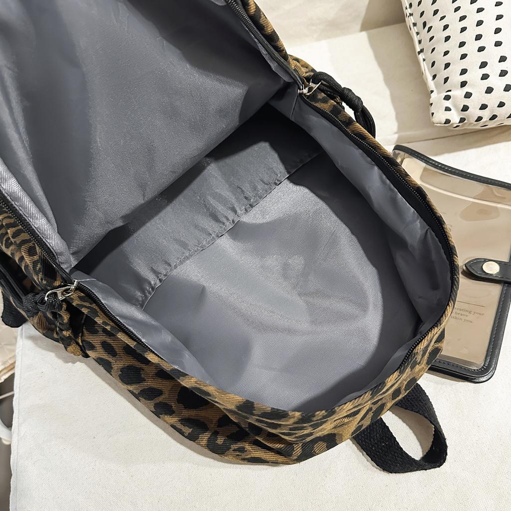 Leopard Print Backpack Casual Daily Use Trendy Street Style Lightweight Backpack for Women with Tassel Detail for School Travel and Everyday Outings