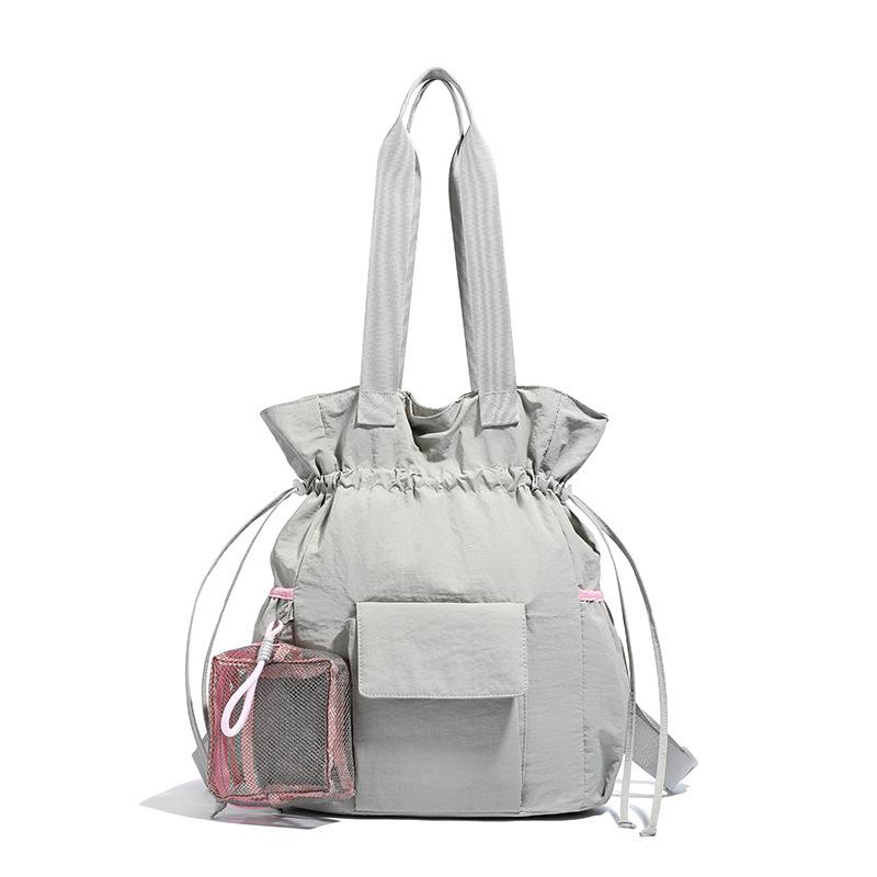 Neue Kurztrip-Reisetasche Macaron-Farbe Einfarbige Sporttasche Yogatasche Kordelzugverschluss Aufbewahrung Umhängetasche