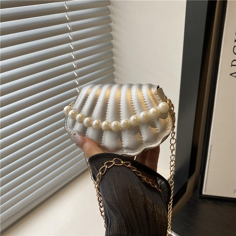 

Stylish and simple messenger bag spring and summer new women s bag shoulder bag niche trend shell bag срібний