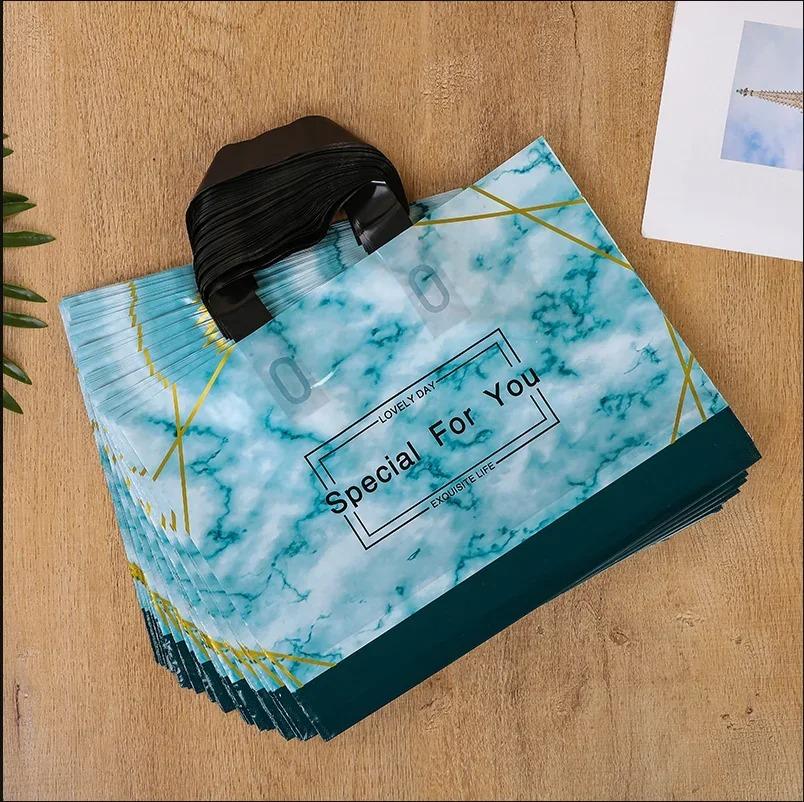 50pcs New models Handbag thick 0.14mm durable clothing cosmetic gift Shopping bags Resilient Powerful handheld Portable Packaging bag