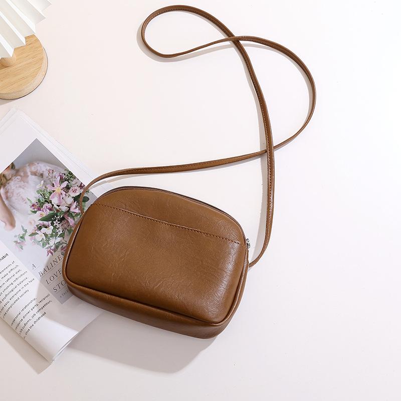 Retro women's simple soft pu leather small round bag solid color new style zip single-shoulder crossbody small bag daily handbag