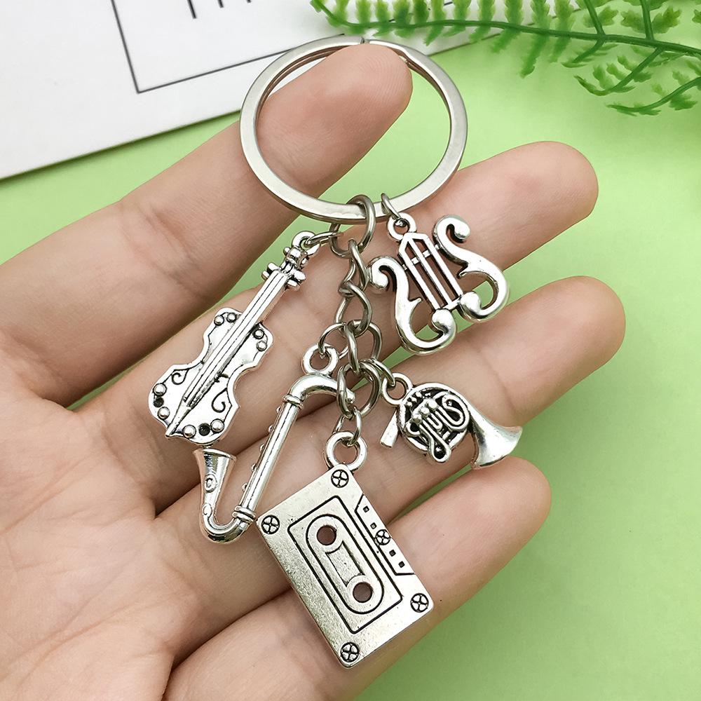 Antique Silver Music Cassette & Saxophone Keychain with Creative Design