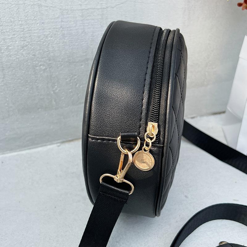 Bag women's new solid color rhombus embroidered messenger small round bag with change small bag fashionable one