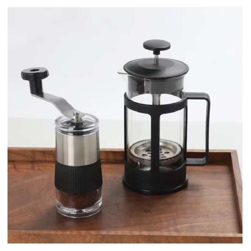 Moderne manuelle Kaffeemühle aus Edelstahl mit einstellbarem Mahlgrad für den Büroeinsatz