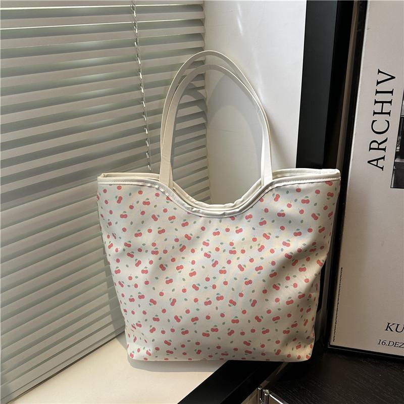 

The new beautiful printed tote bag is fresh and casual for students to commute in class. Versatile shoulder armpit bag Вишня