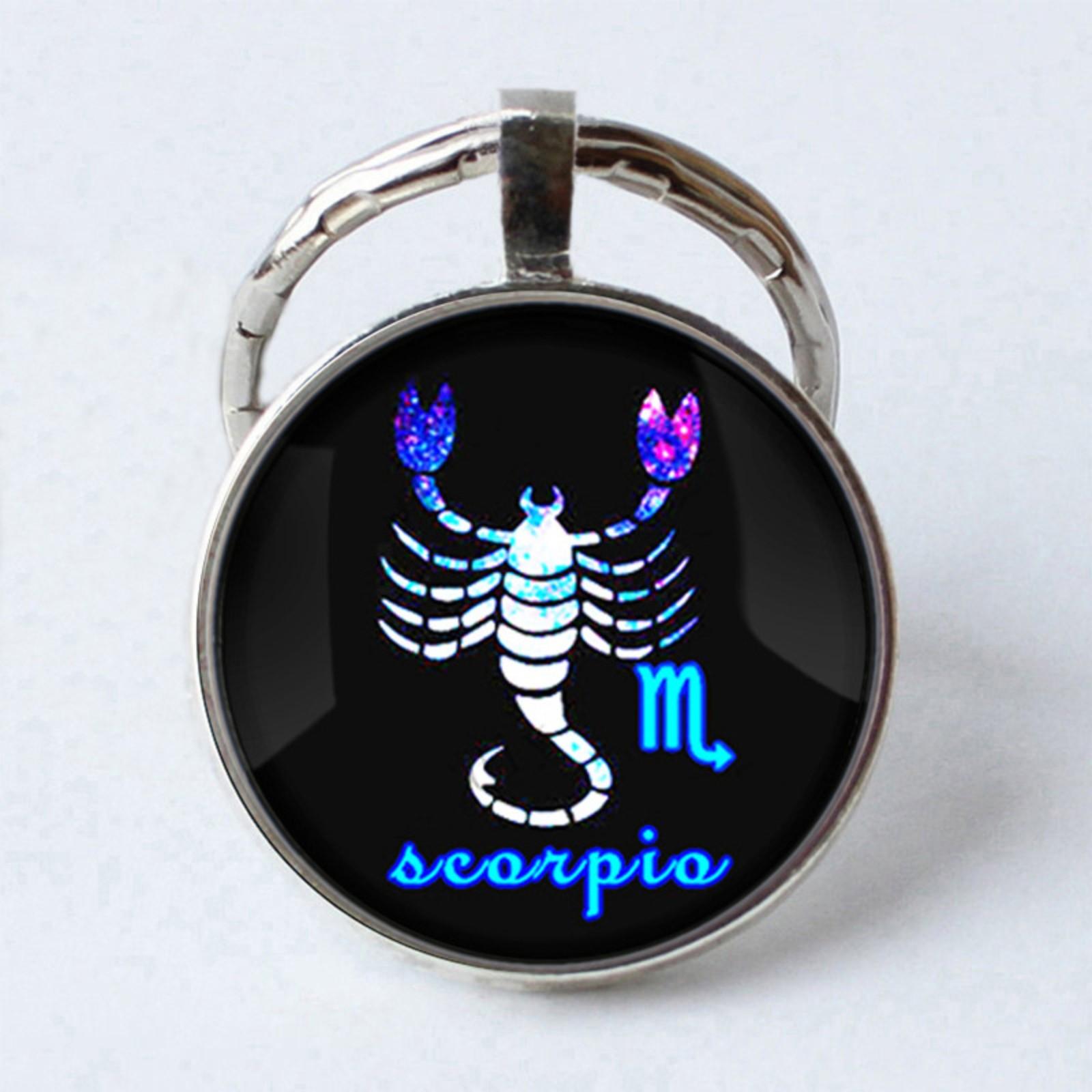 

Металлический брелок с драгоценными камнями и символами зодиака One Size