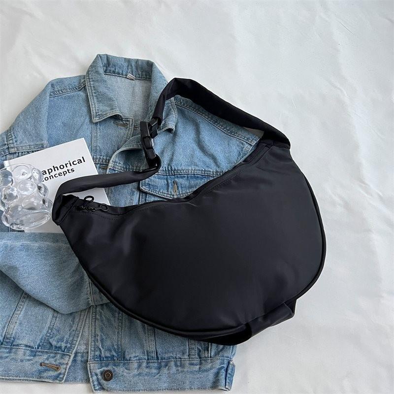 

Trendy Fashionable Black Sling Bag For Women With Unique Dumpling Shape