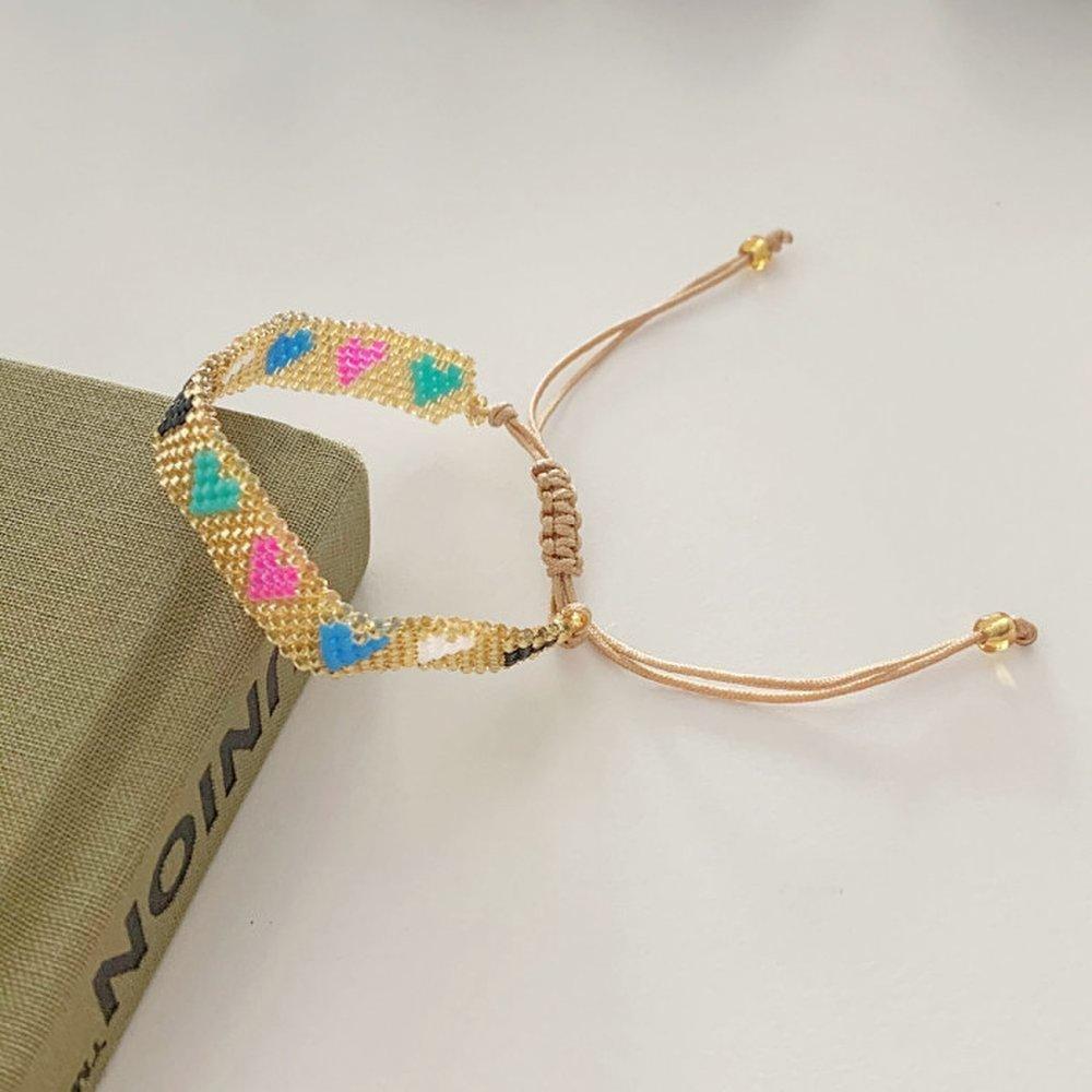 

Браслет з бісеру Miyuki Delica золотого кольору у формі серця