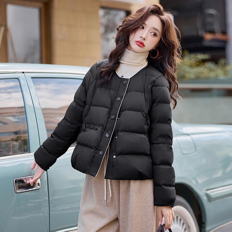 

Xiaoxiangfeng lightweight down jacket women s short 2025 winter design sense round neck warm white duck down casual top tide M чорний