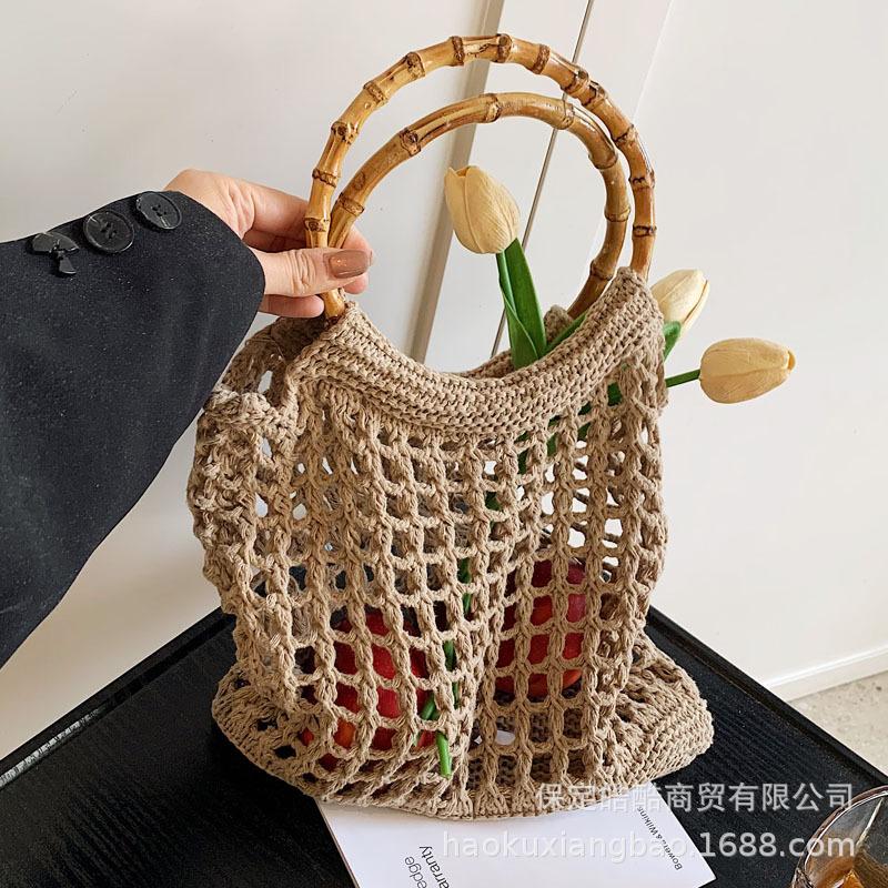 Hand carry woven bag women's Korean version ins fashion simple casual straw bag 2025 niche high-end hollow women's bag