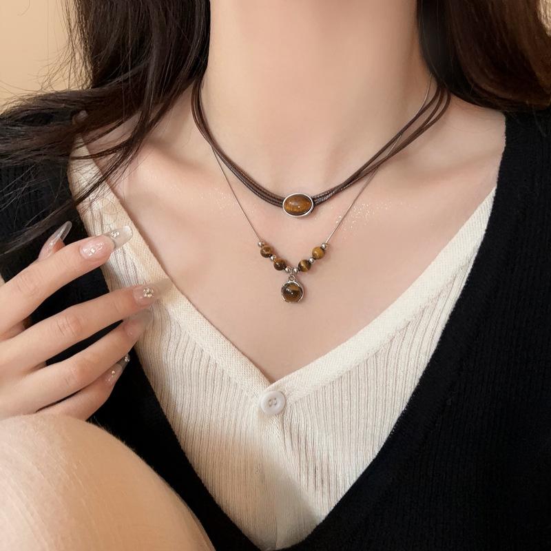 Vintage leather tiger's eye stone pendant necklace women's light luxury niche collarbone chain high-end double-layer stacked sweater chain