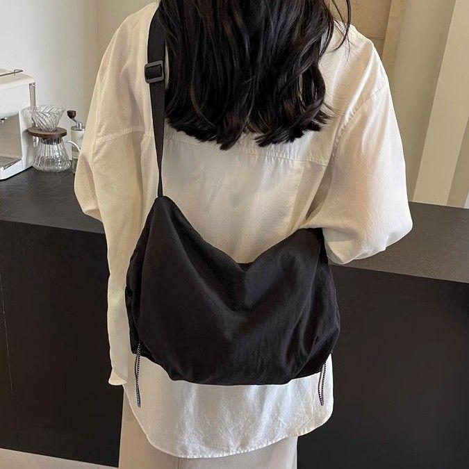 

Unisex Large Capacity Waterproof Nylon Crossbody Dumpling Bag for Cycling and Casual Use