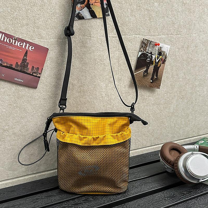 Casual messenger bag new fashion versatile commuter sports bucket shoulder bag women's mobile phone bag