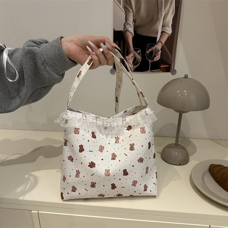 

Trend printing cute bear Korean version large-capacity tote bag women s versatile casual personality simple shoulder bag