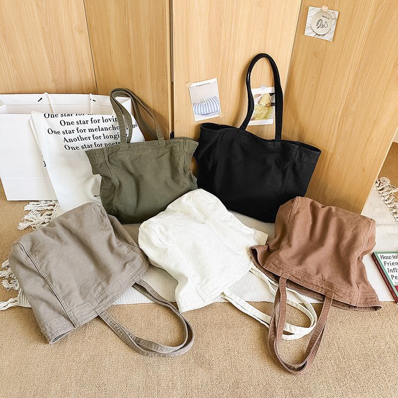 Lazy wind canvas bag, new large-capacity commuter tote bag, casual versatile shoulder bag, portable shopping bag.