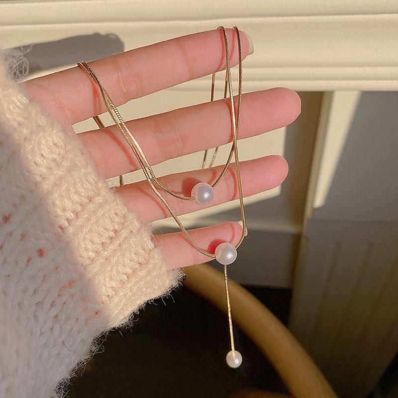 Double-layer pearl collarbone chain Versatile temperament Niche design necklace Female personality Autumn and winter sweater chain