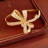 Ningguang Gold-Plated Zirconia Bow Cuff Bracelet: Luxury European-American Fashion Accessory