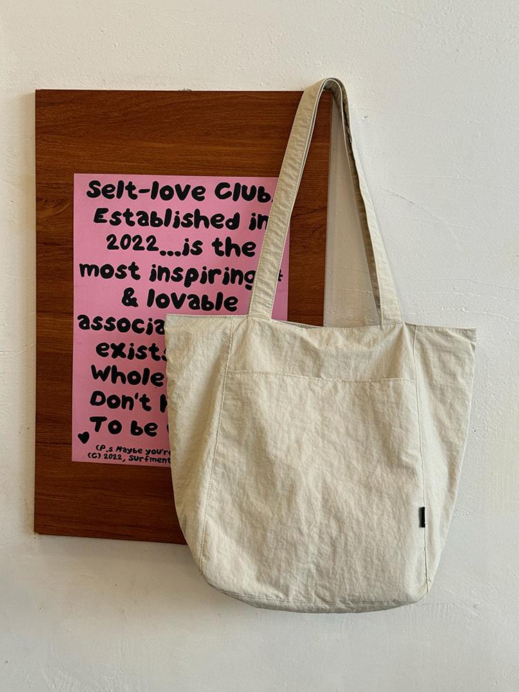 Korean simple solid color canvas bag women's 2025 new large-capacity lightweight shoulder tote bag versatile commuter bag