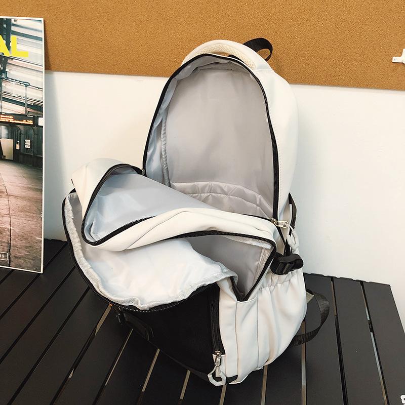 New super cool backpack, high value and large capacity, primary and secondary school student schoolbag, simple contrasting color spine protection