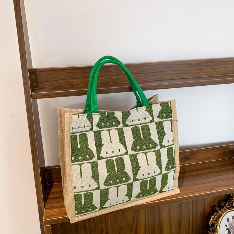 Handtaschen mit großem Fassungsvermögen sind dieses Jahr beliebt, und Damen 2025 neue trendige Mode und niedliche Schultertaschen mit Kaninchenaufdruck.