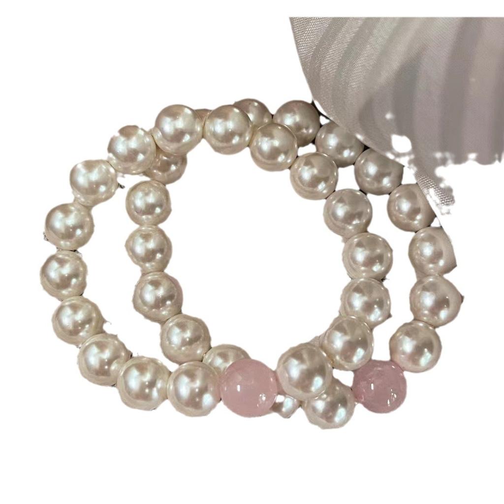 Original design, featuring a beaded pearl bracelet with natural Madagascar rose quartz beads
