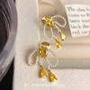 Bow pearl tassel unique pearl earrings mosquito coil disc ear clips sweet temperament stud earrings spring earrings