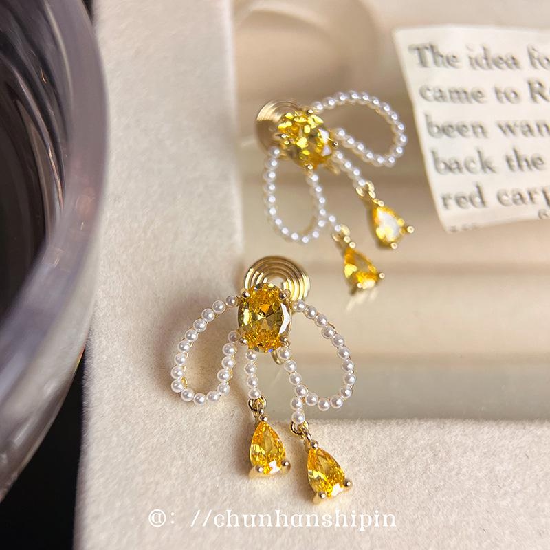 Bow pearl tassel unique pearl earrings mosquito coil disc ear clips sweet temperament stud earrings spring earrings