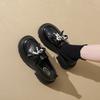 Mocassins plateforme style britannique enfants automne 2025 nouvelles chaussures femme à une pédale chaussures simples à nœud petites chaussures en cuir