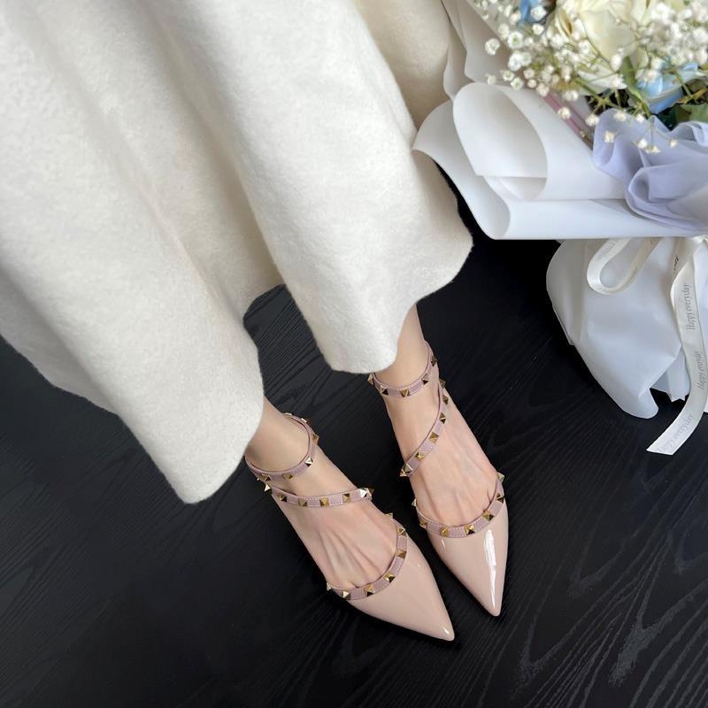 

Black and white pointed head rivet high heels women s thick heel spring 2025 new half bag head word with sandals single shoes women 40