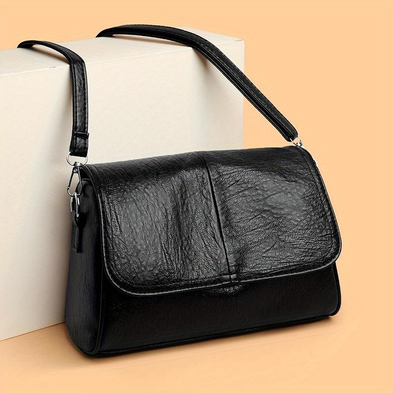 Retro-style solid color crossbody bag with adjustable shoulder strap, suitable for everyday wear and commuting. Large capacity, single shoulder