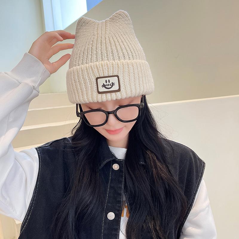 Autumn and winter new labeling cold hat versatile smiley face wool hat women's big head circumference ear protection warm hat thickened knitted hat