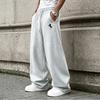 Loose-fitting men's straight-leg sweatpants with a drawstring waist feature convenient pockets, perfect for both home and on-the-go