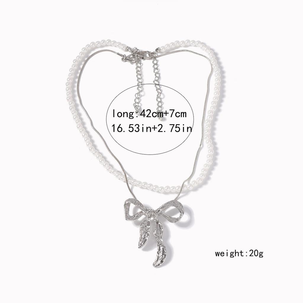 Light luxury imitation pearl fashion one more wear personalized metal bow pendant women's necklace