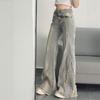 American retro micro-pull jeans women's 2026 spring and summer new rough edge splicing design sense slim and thin horseshoe pants