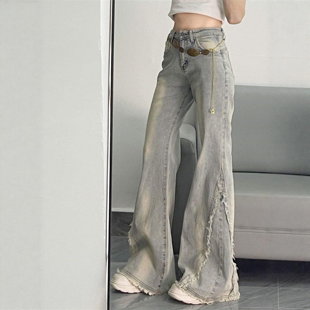 American retro micro-pull jeans women's 2026 spring and summer new rough edge splicing design sense slim and thin horseshoe pants