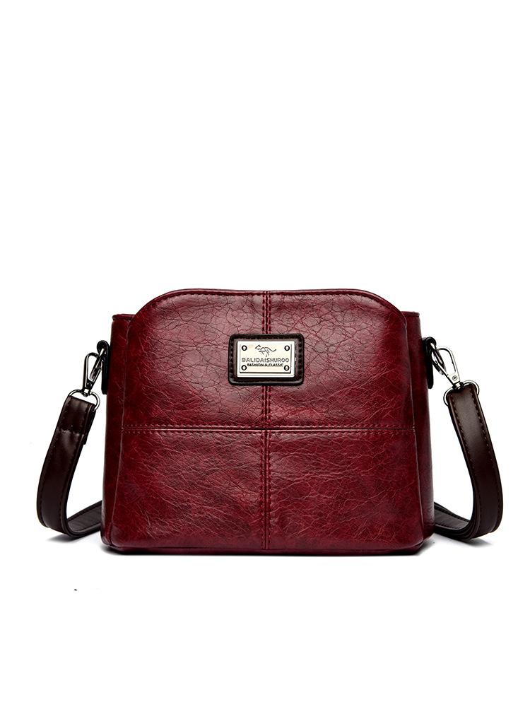 

2025 new Korean version single shoulder women s bag soft leather versatile large capacity embroidery thread middle-aged women s mother oblique span ba бордовий
